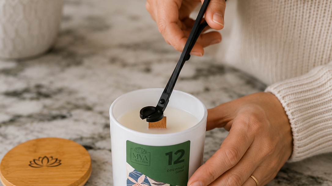 Woman trimming the wooden wick of a Mya Collection candle